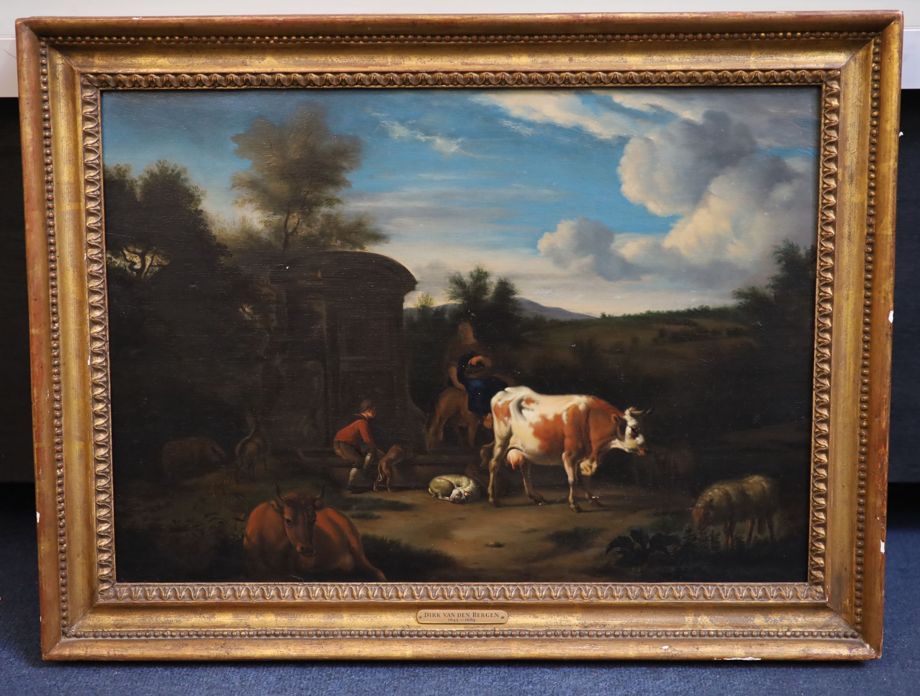 Circle of Dirk Van Den Bergen (1645-1689), Landscape with figures, cattle and sheep beside a Roman well, oil on wooden panel, 34 x 48cm